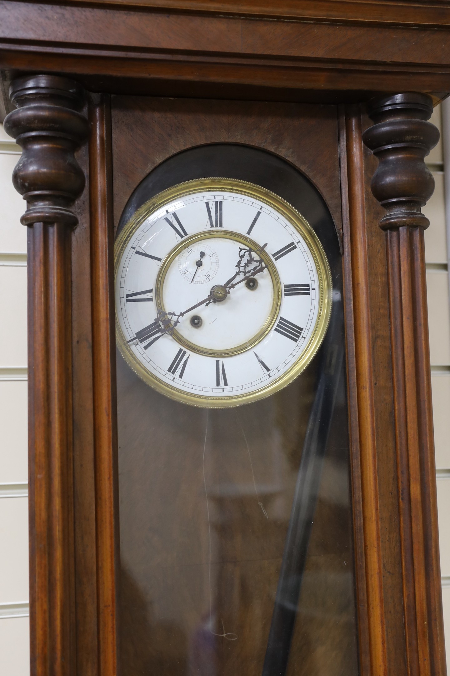 An early 20th century Vienna type wall clock